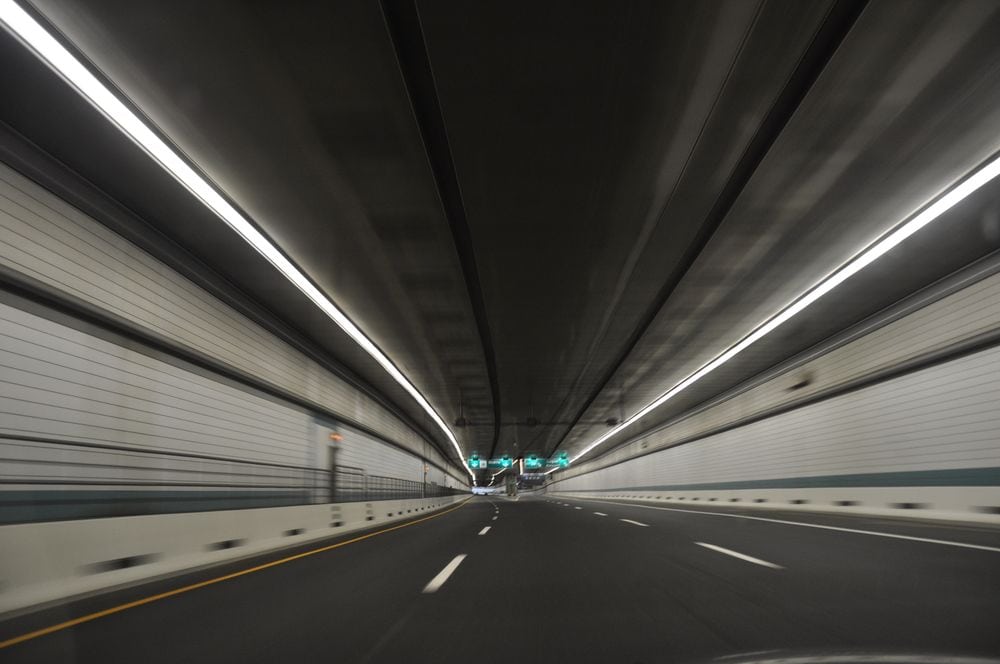 longest tunnels in us traffic empty 3 lane tunnel