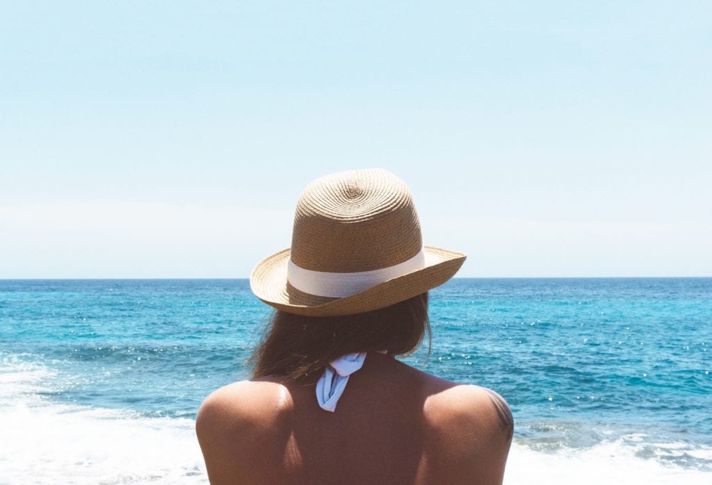 protect your skin girl near water Healthy Traveling