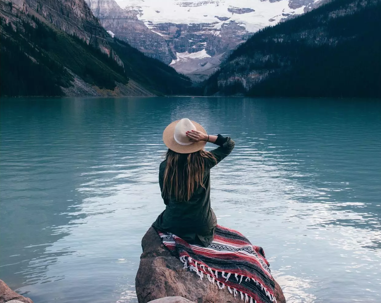Woman looking out into the water; travel photography