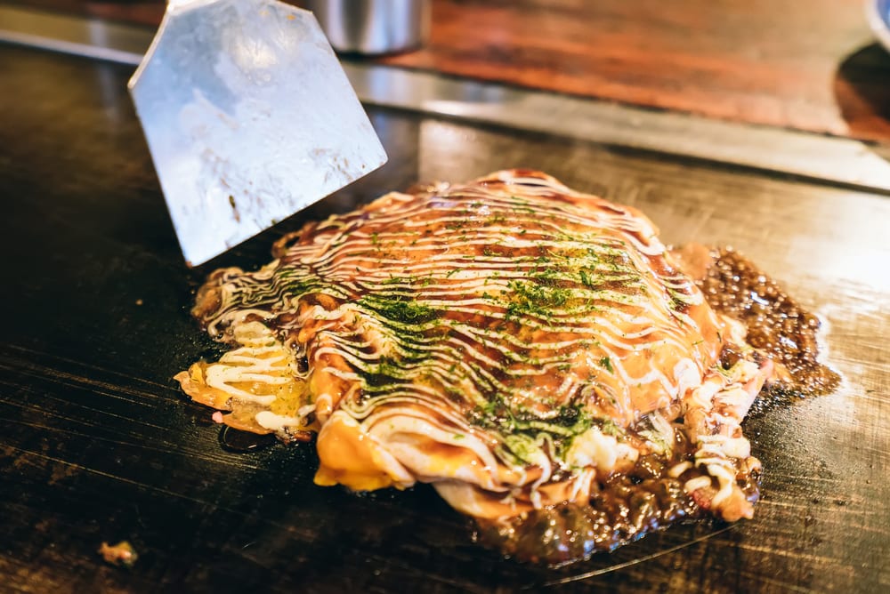 best tokyo food - Okonomiyaki grilling