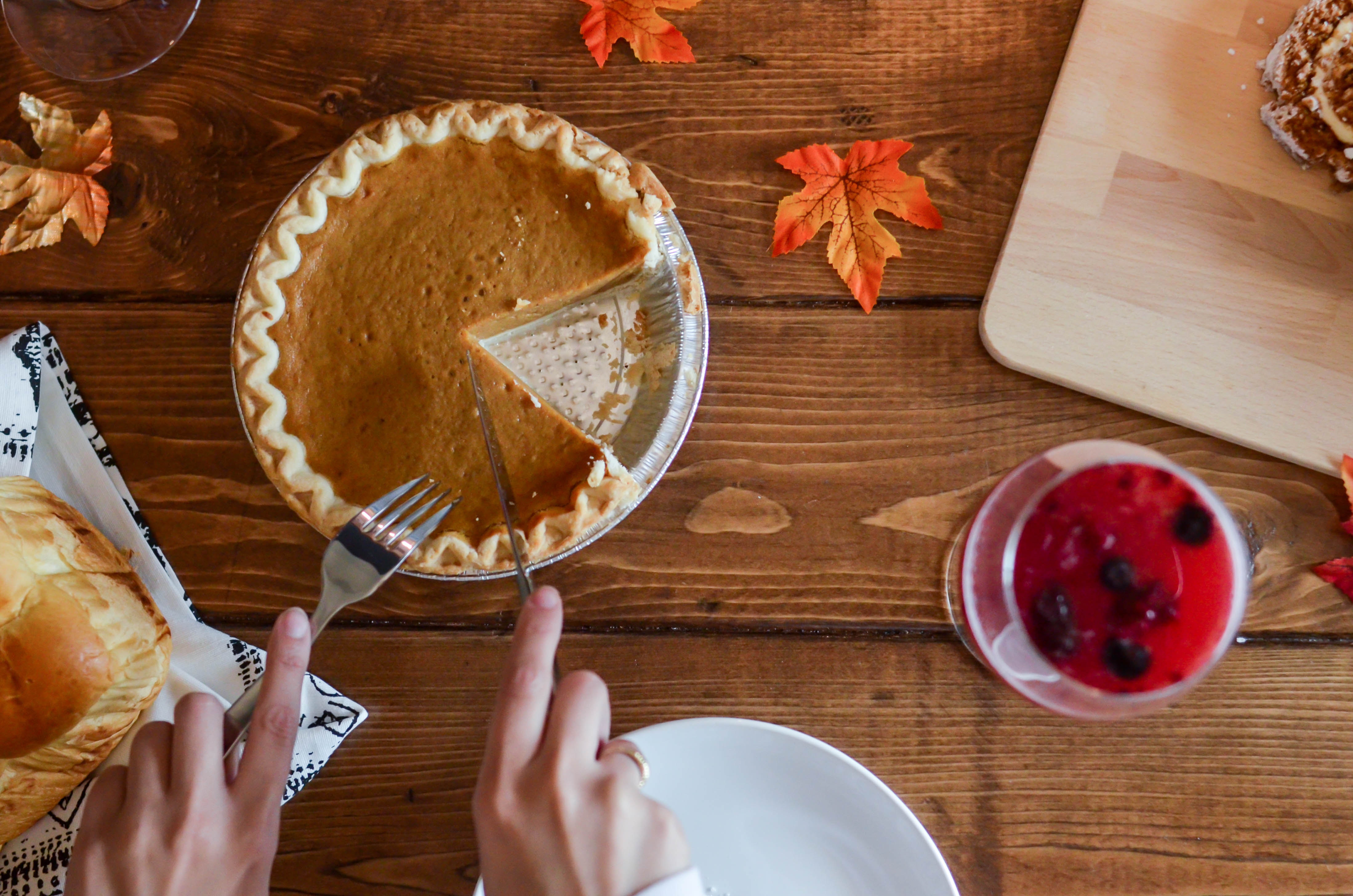 Fall Photos cutting into pumpkin pie