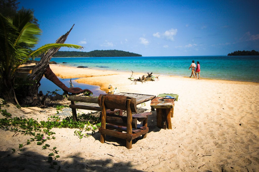 wooden chairs and tables on koh rong island