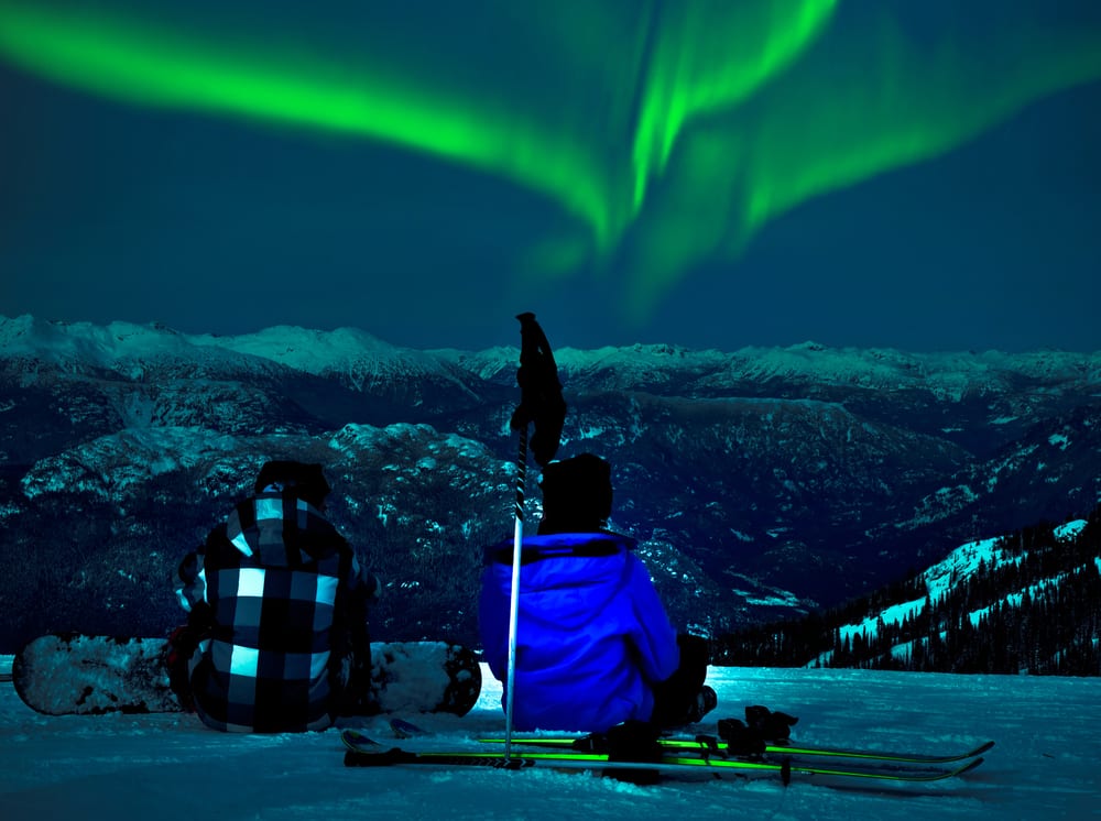 Couple watching the Northern Lights in Fairbanks, Alaska