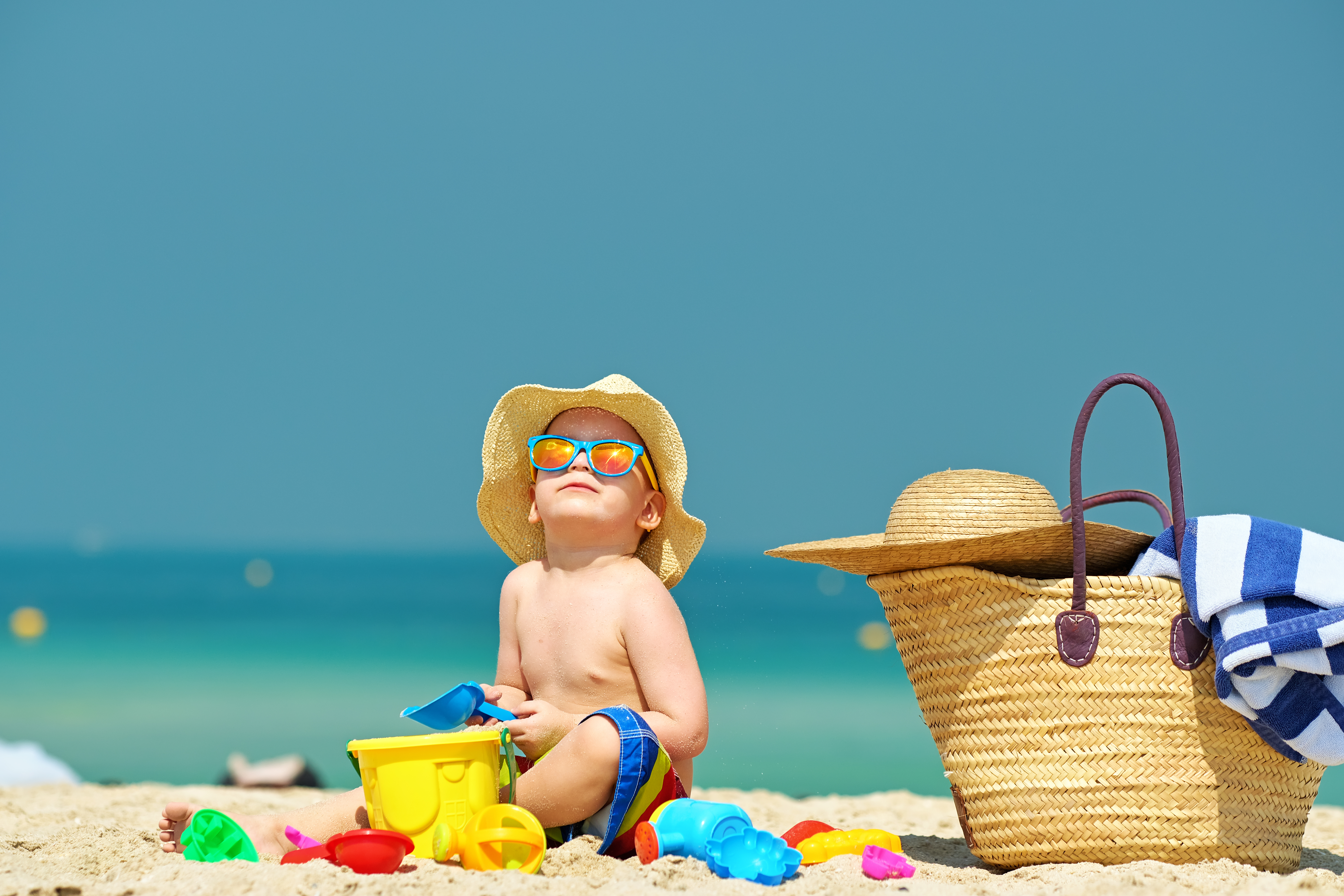 tips for traveling with kids play at beach