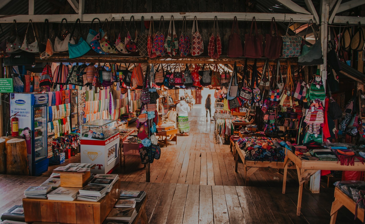 buy souvenirs from a local market