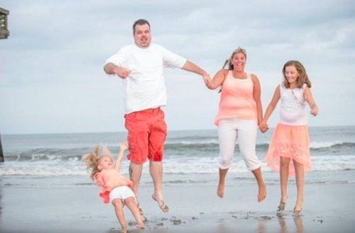 awkward moment when you try to get a family photo on the beach