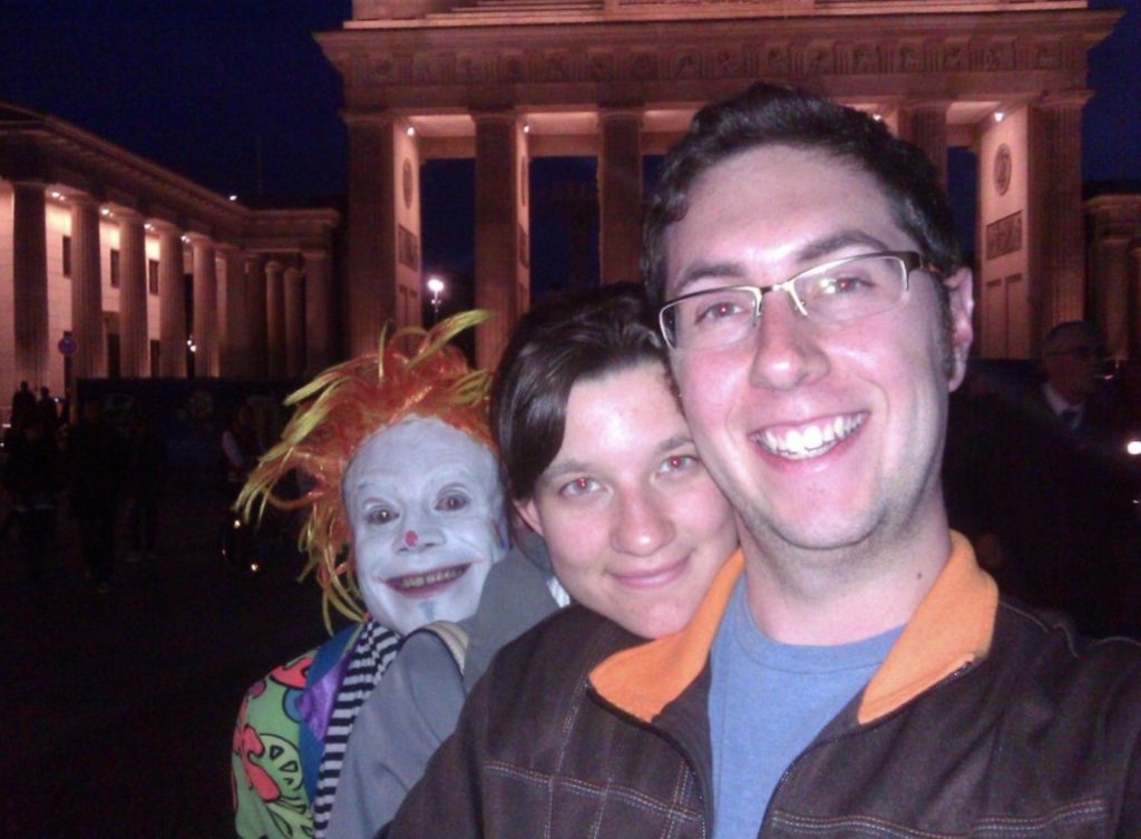 scary clown photobombs couple