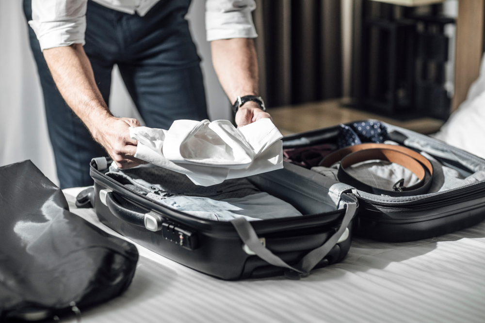 packing hacks for business travelers man packing