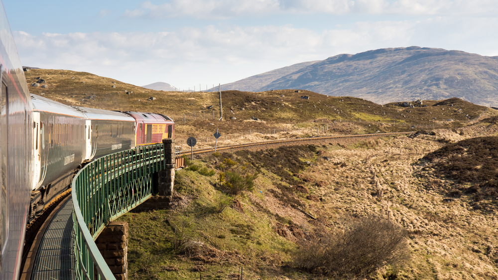 The Caledonian Sleeper train crosses Rannoch Viaduct on the scenic West Highland Line railway