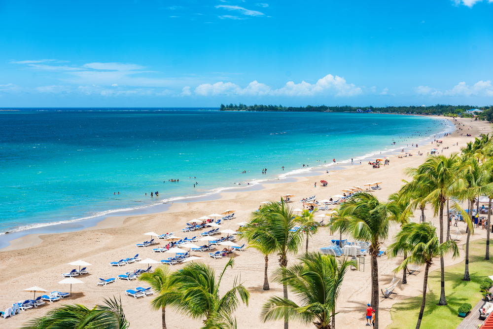 Puerto Rico beach travel vacation landscape background. Isla Verde resort in San Juan, famous tourist cruise ship destination in the Caribbean