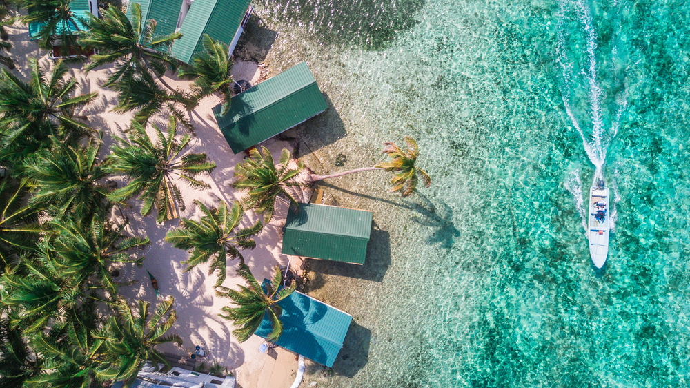 Tobacco Caye aerial in Belize barrier reef with boat