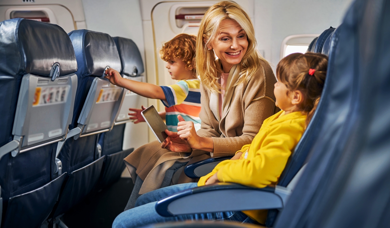Mom Sitting Next To Kids On Plane