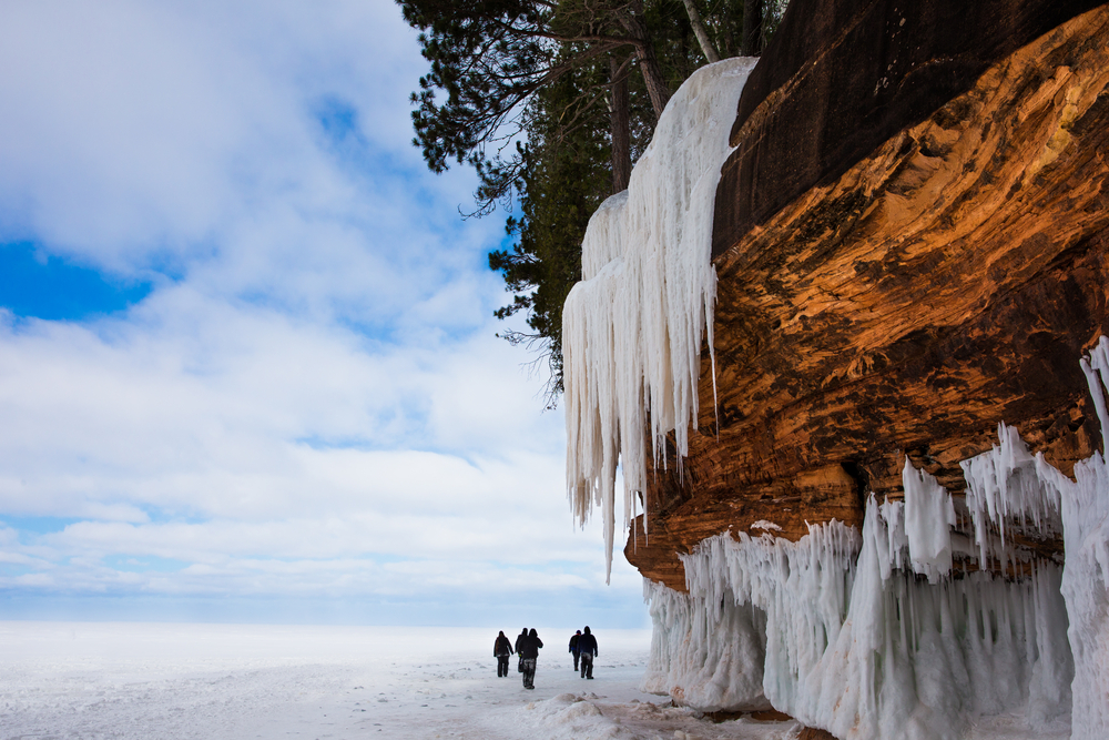 Frozen,Lake,Superior,Shoreline.,Orange,Cliff,,Large,Icicles,,People,For