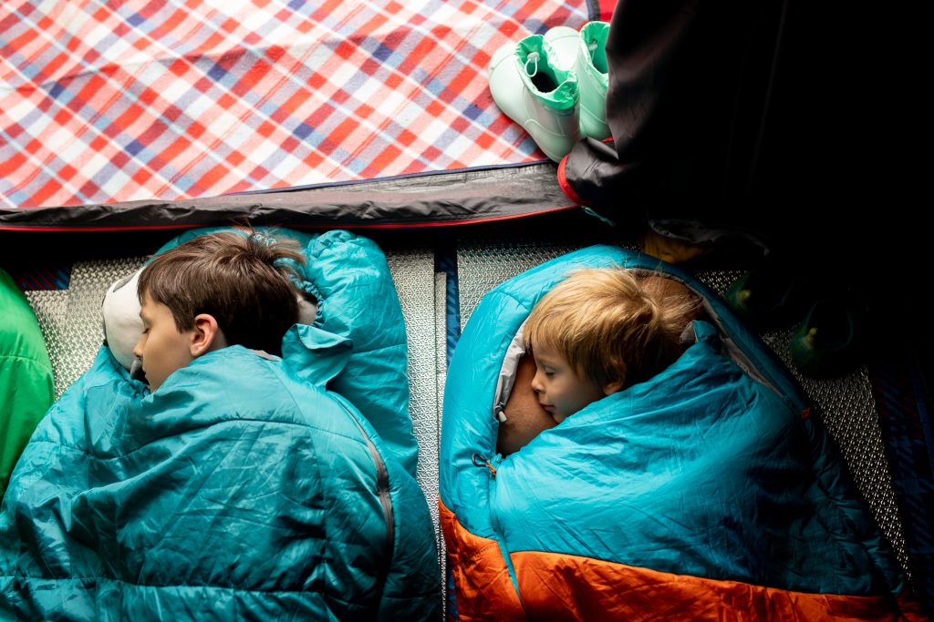 Kids asleep in sleeping bag