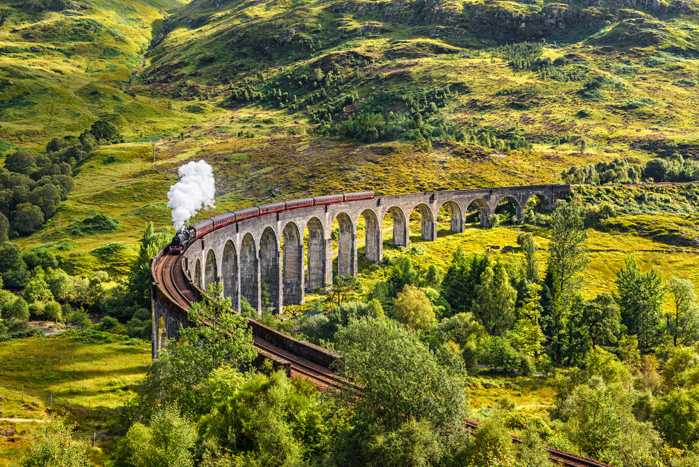 Glenfinnan,Railway,Viaduct,In,Scotland,With,The,Jacobite,Steam,Train
